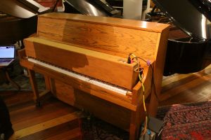 Piano number two with Trimpin's computer controlled pianola attached to the keyboard