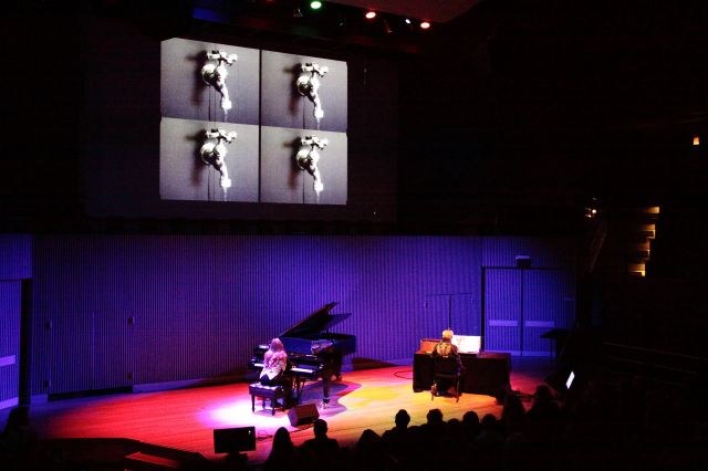 Don Buchla on the Buchla Bos and Nannick Buchla on the piano with film projection performing Drop by Drop (2012) in its American premiere.
