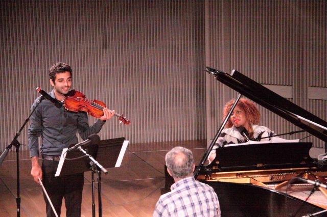 Wallen performing her birthday song with the captive host of the evening looking on amused.