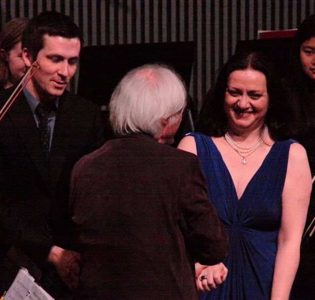 The triumphant soloist and conductor accept the gratitude of the audience, the producers and the composer.